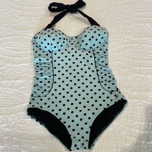 Retro style one piece swimsuit with fitted bra.